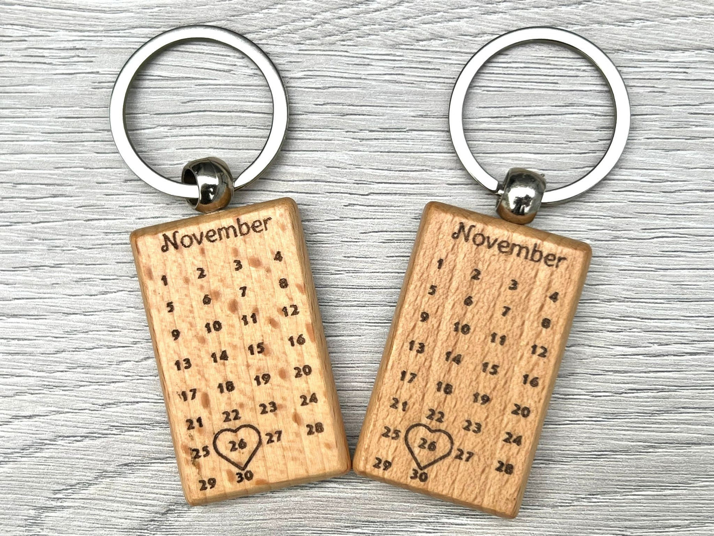 Matching wedding date keepsake keyrings in a handmade box, unique couples keychains.